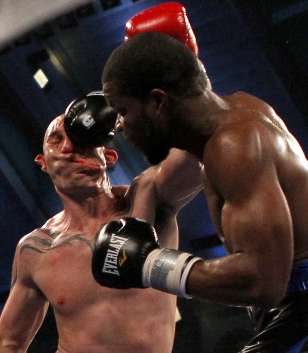 Boxer Lavarn Harvell (R) connects to the head of Tony Pietrantonio for a knockout during their third round of light heavyweight boxing fight in Atlantic City, New Jersey April 28, 2012.