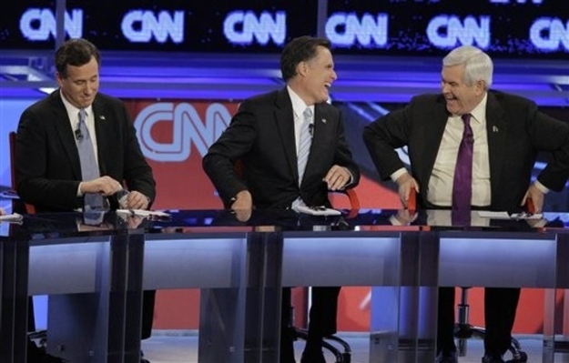 Mitt Romney laughs with Newt Gingrich at a Republican debate. (AP)