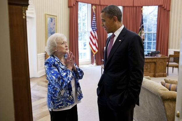 U.S. President Barack Obama talks with actress Betty White in the Oval Office at the White House in Washington in this handout photo taken June 11, 2012.