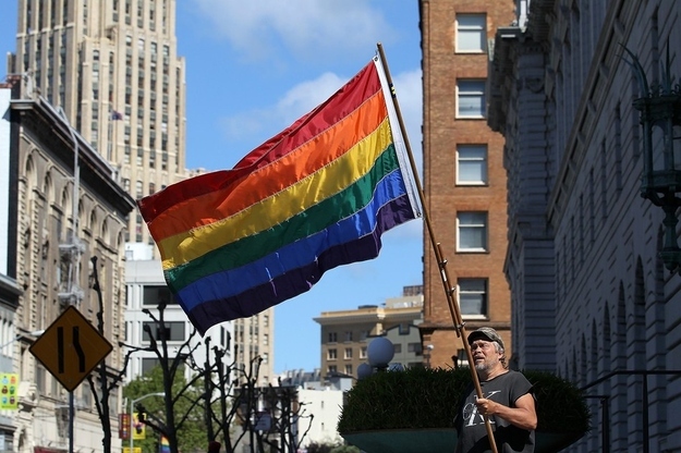 A gay-rights supporter waves a gay pride flag outside of the Ninth U.S. Circuit Court of Appeals in San Francisco on June 5, 2012.