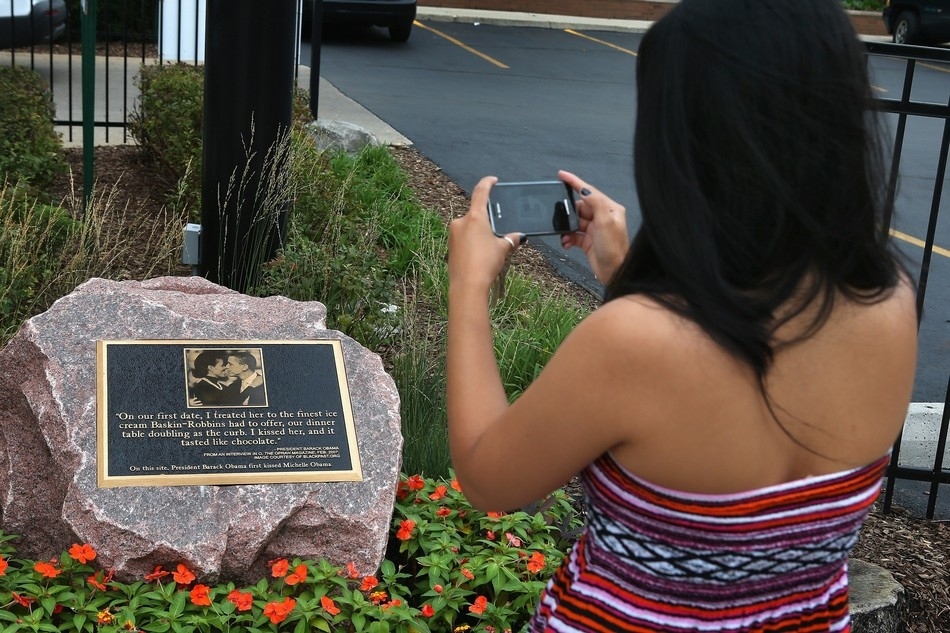 A 1,350-kg granite historical marker with a plaque reading, 'On this site  President Barack Obama first kissed Michelle Obama' is seen outside a  shopping center in the Hyde Park neighborhood of Chicago