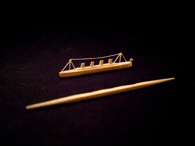 A miniature replica of the Titanic created from a single toothpick and glue.Dimensions: 1 5/8"(L) x 5/32"(W) x 11/32"(H)