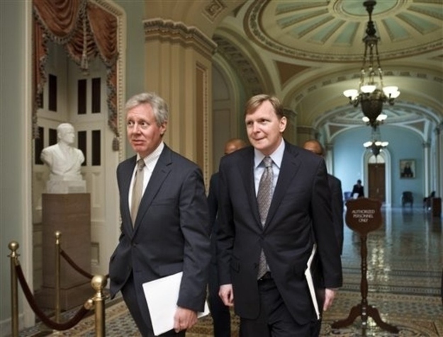 Messina, right, and strategist Jim Margolis, left, walk to a meeting off the Senate floor this May.