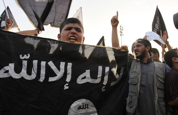 Libyan followers of Ansar al-Shariah Brigades chant anti-U.S. slogans during a protest in front of the Tibesti Hotel Sept. 14.