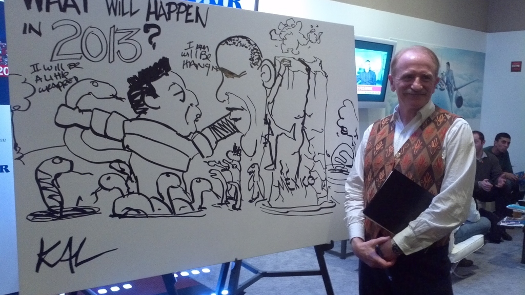 This is Kal, the longtime illustrator for The Economist, next to the drawing he created during his talk.