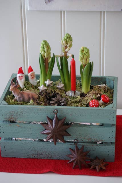 Set tiny plastic reindeer and Santas in any houseplant.