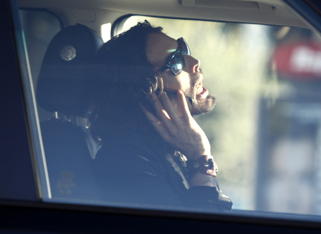 *Looks in rear-view mirror, sees something strange and green hanging from a nostril.*