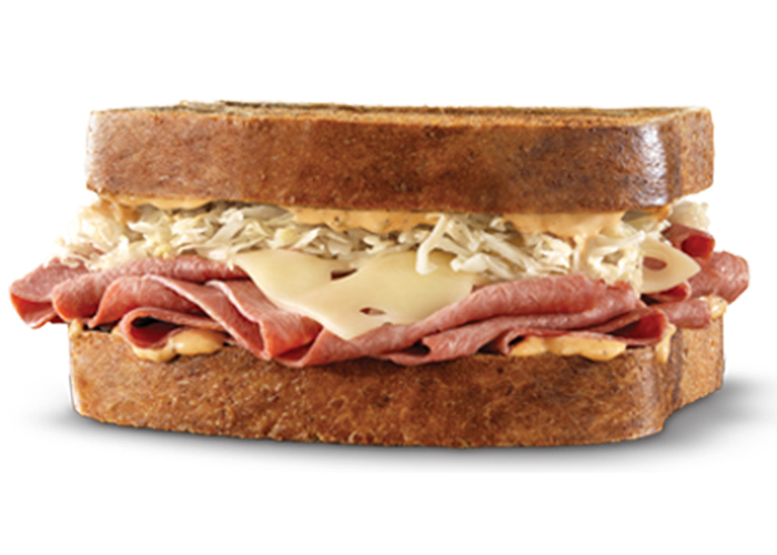 Thinly sliced corned beef with melted Swiss cheese and tangy sauerkraut topped with thousand island dressing on a soft, toasted marble rye bread.