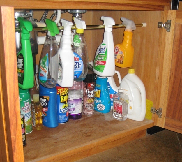 Keep your cleaning supplies neat with a tension rod.