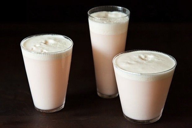 gin + lemon juice + lime juice + rhubarb syrup + cream + rosewater + egg white + ice + soda water. Get the recipe.