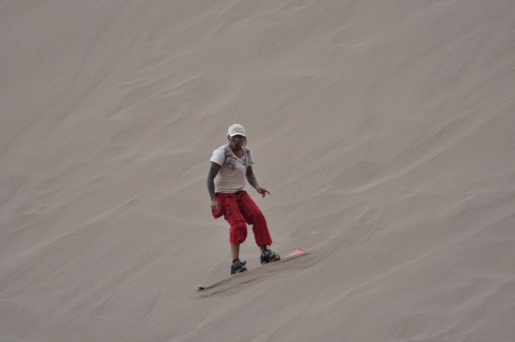 It's like snow boarding, except when you fall, your jacket isn't filled with snow. In fact, your jacket isn't filled with anything. There is no jacket. You're in Chile.