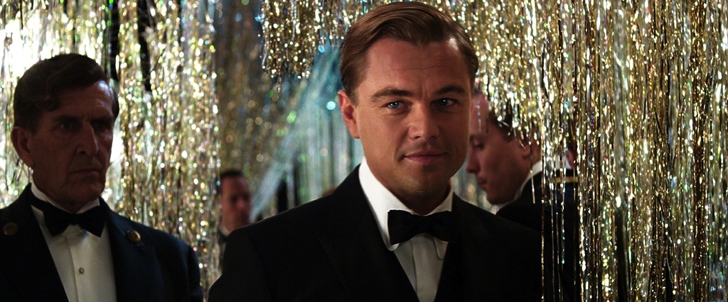 Leonardo DiCaprio looks gorgeous standing in front of gold tinsel