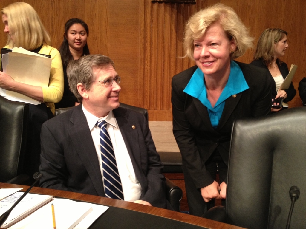 Sen. Mark Kirk, left, talks with reporters on Wednesday. Out lesbian Sen. Tammy Baldwin also sits on the committee that voted for the bill on Wednesday.