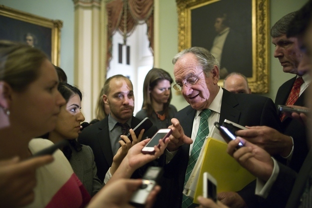 Senator Tom Harkin talks with reporters on June 25, 2013.