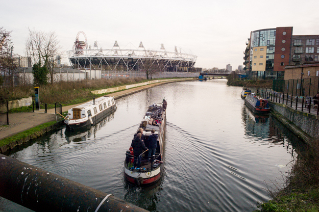 The Olympic Stadium has finally secured its future in a 99-year contract with West Ham United Football Club. The deal, which has been criticized by former sports minister Richard Caborn, will cost British taxpayers millions.The £600 million Olympic arena has been sold to the Premier League club for a fraction of its worth - only £15 million plus an annual rent of £2 million.Residents in the surrounding area are still worried that the Olympic infrastructure will buoy the cost of rent, pricing them out of their neighbourhoods."Some of the artists and narrow-boat owners I spoke to were concerned that the neighbourhood’s proximity to Queen Elizabeth Olympic Park and the stadium would cause housing prices to skyrocket, pushing people out of their homes," photographer Jon Pack said. "I felt like this photo captured that uncertainty, with life as usual taking place in the foreground as the stadium looms at the top of the frame."