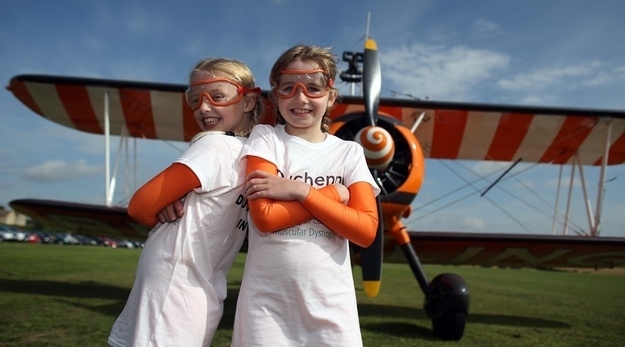 Rose Brewer (L) and Flame Brewer (R) prepare to wingwalk over Rendcomb airfield in Gloucestershire.