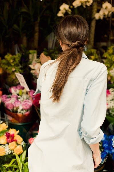 Divide the ponytail into two sections, then twist one section and wrap around the other section to create this casual twisted ponytail.