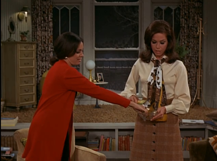 A killer apartment is great (look at that giant window!), but with real estate it's all about location, and hers is located right below her best friend. Not just any BFF, but Rhoda, a street smart New Yorker who is supportive, fun, and is willing to share great advice.. and candy.