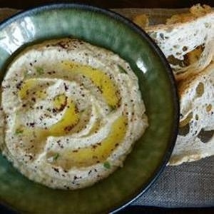 Don't be intimidated, courgette is nothing more than the French word for zucchini. What results from their combination with borlotti is a supremely creamy hummus with a wonderfully fresh background flavor.