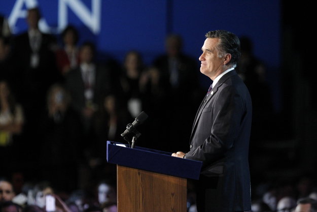 Romney pauses as he addresses supporters during his election night rally.