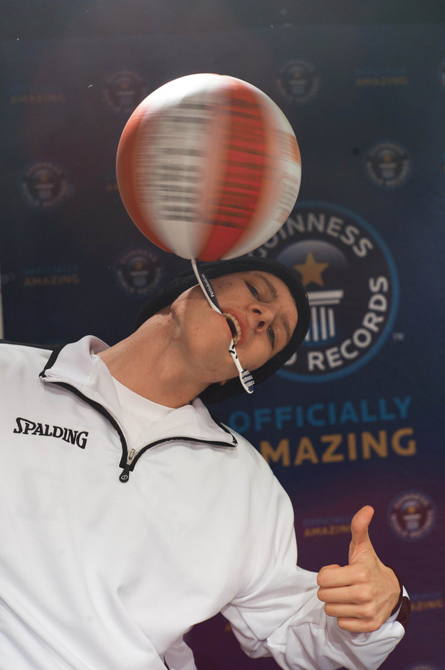 Michael Kopp, 18, spun a basketball on a toothbrush held between his teeth for just over 26 seconds.