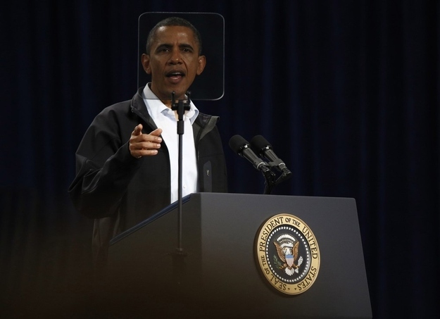 President Obama looks through his teleprompter as he participates in a campaign rally at Springfield High School in Ohio. (Reuters