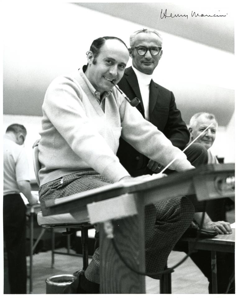 Smokin' his pipe and composing.. LIKE A BOSS! "Um, there's no smoking in here"*Mancini smile*"Can I fix you a drink with that, sir?"