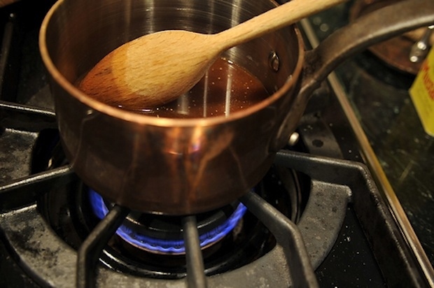 Strain ham drippings, and heat ham stock in a small saucepan over medium heat to boiling. Add 1/2 teaspoon dry mustard, 1/4 cup brown sugar, pinches of nutmeg and ground cloves, and cook until thickened. Let your guests douse their own ham with sauce. This is a personal thing.