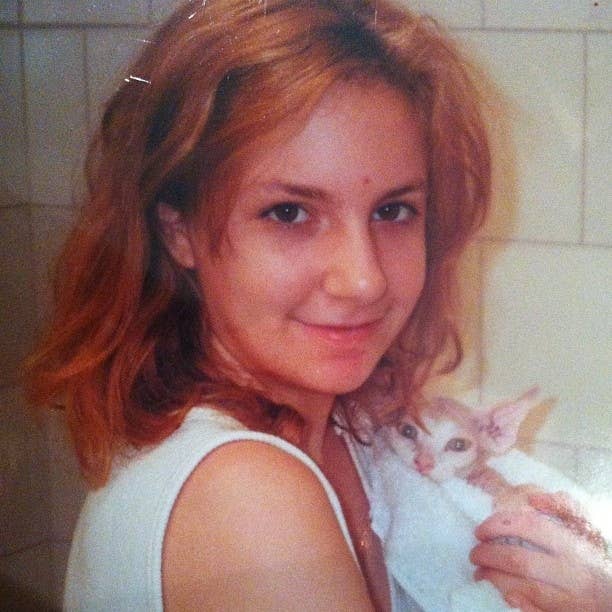 From Dunham's Instagram: "Me circa 2001 with my new hairless kitten Thor."