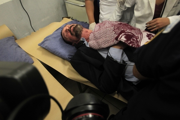 Paramedics observe U.S. anti-virus software guru John McAfee at the Policia Nacional Civil hospital in Guatemala City, Dec. 6, 2012. According to McAfee's lawyers, he was feeling as though he might lose consciousness and experiencing heart problems. Authorities have since confirmed that he did not have a heart attack.