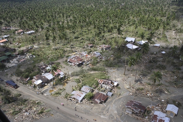 An aerial view of damaged houses caused by flash floods in Compostela Valley province, southern Philippines is seen in this handout photograph provided by the Philippine Army 10th Infantry Division, Dec. 6, 2012.