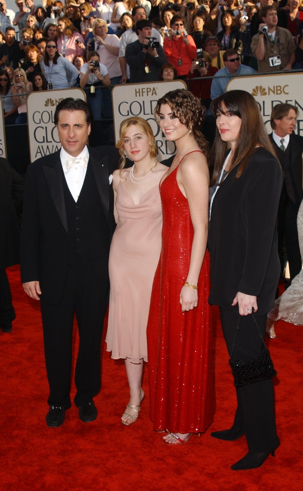 She's the one in the red dress, with her father Andy Garcia.