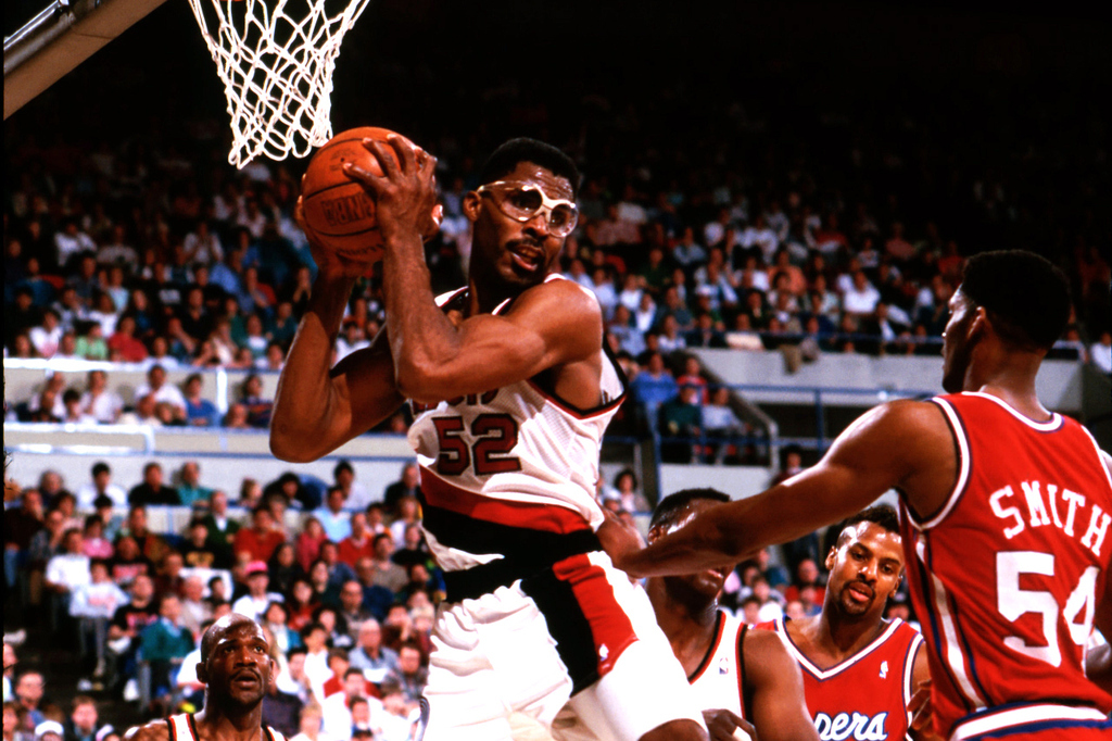 Although Buck and his goggles came to fame when he helped Portland reach three straight Western Conference Finals and two NBA Finals from 1990-92, the ferocious rebounder spent 1981-89 as a Net (where his No. 52 is retired) and finished his career with the Knicks from 1996-99.