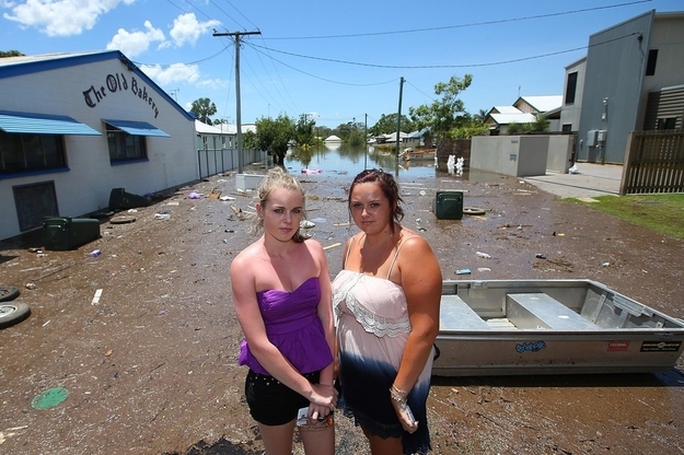 Hayley Painter and Tamara Cummins stand in their street in Bundaberg, Australia.