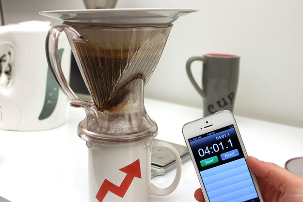 At the end of the four minutes, take the dripper off of the scale and set it on top of the coffee cup.