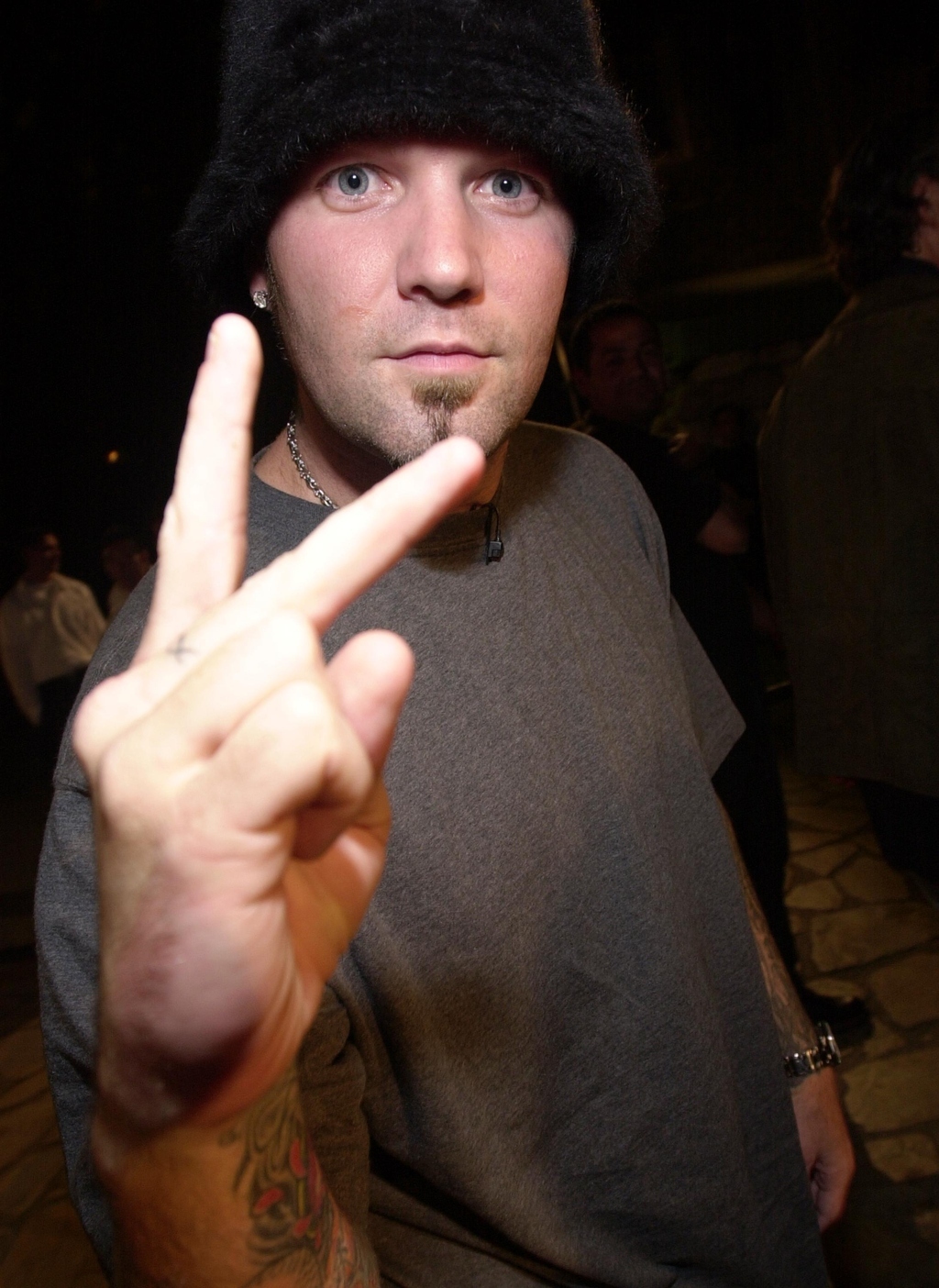 Throwing up a classic peace sign.
