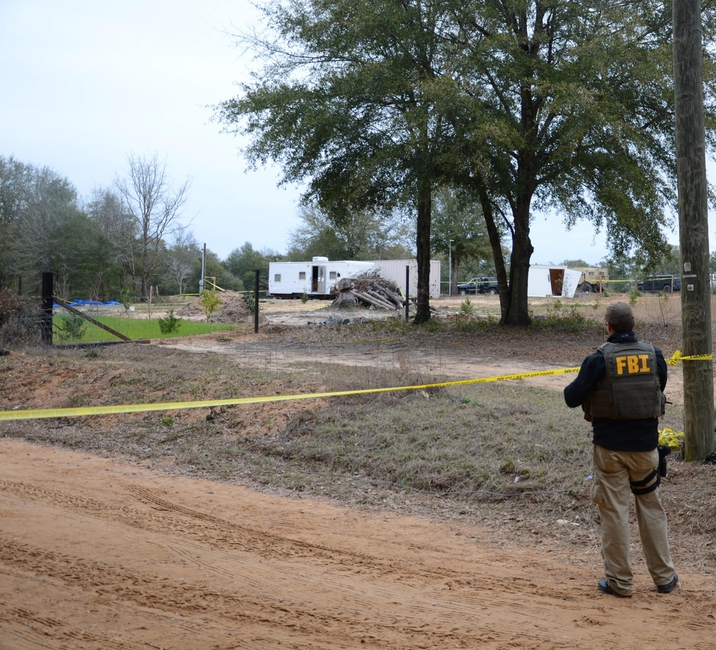 FBI agents and Dale County Sheriff’s Deputies secure the residence after the 5-year-old boy was rescued.