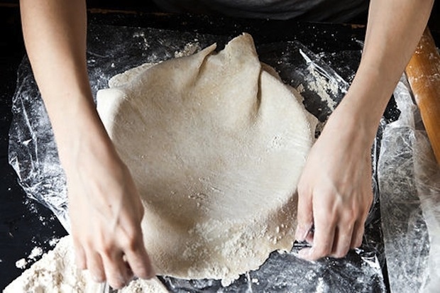 If you miss the mark, just gently shift it into place. It'll be okay. Try not to stretch the dough, just guide it. Then send it to the freezer while you make your filling.