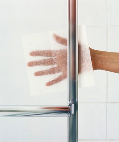 Dryer sheets will remove buildup from glass.