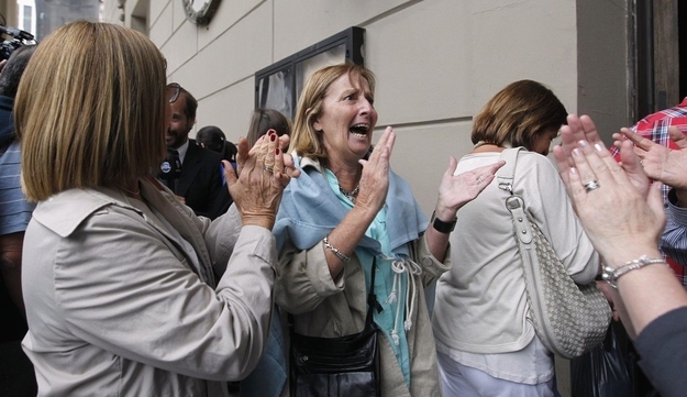 More Roman Catholics cheer at the Metropolitan Cathedral.