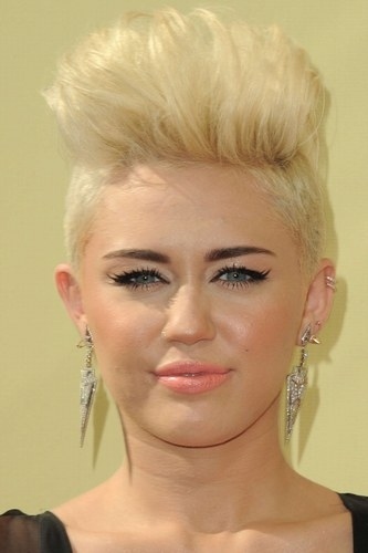 Miley is as unsure about that poof as we are.