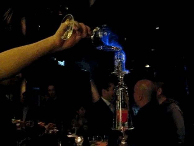 Once lit, you quickly drink it down with a straw at the base of the flaming tower: