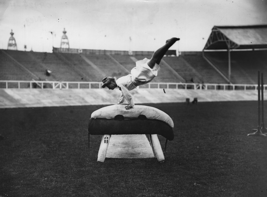 In 1908, female gymnasts wore long dresses while competing. Get it, girl.