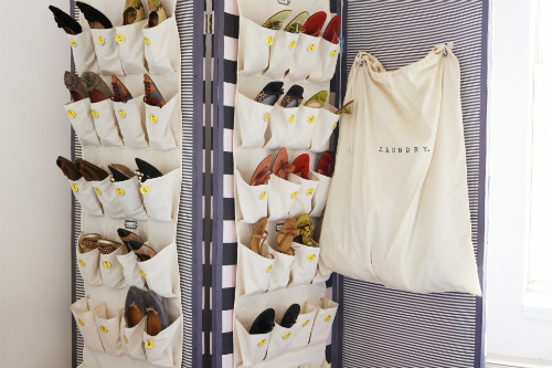 Hang shoe organizers on a room divider or screen.