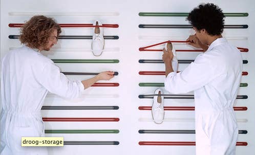 These are $25 from Droog but you could attempt to make your own with wall pegs and bungee cords.