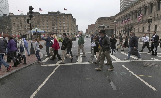 Residents, employees and business owners are escorted across Darmouth Street on Tuesday.