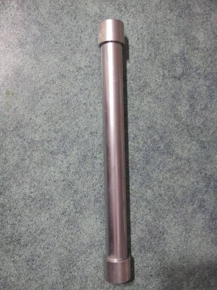 Just a PVC pipe painted silver with a map inside.