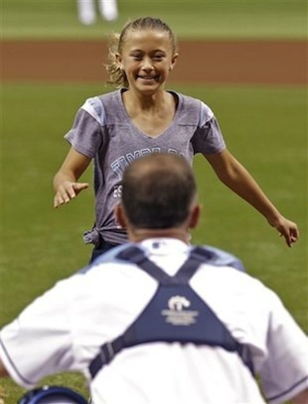 After Alayna Adams threw out the first pitch in the Tampa Bay Rays-Boston Red Sox game, her father, Lt. Col. Will Adams, gave her a surprise visit after being deployed overseas in Afghanistan for the past two years.