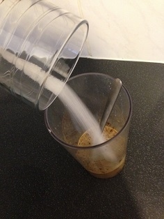 So, start with adding the milk to the coffee and giving it a little stir, followed by the sugar. Don't worry about little grainy bits, that comes later.