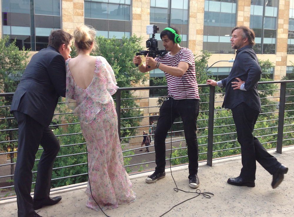 Ethan Hawke and Julie Delpy, shooting their "Don't Talk" PSA for the Alamo Drafthouse, while director Richard Linklater (far right) watches